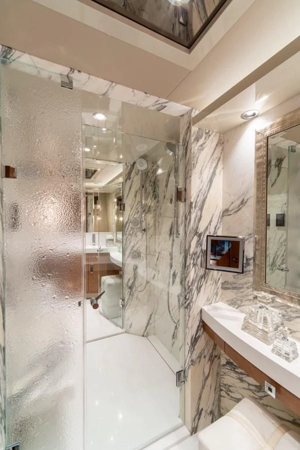 a bathroom with a shower and sink aboard WESTPORT 112 #7766 Yacht for Sale