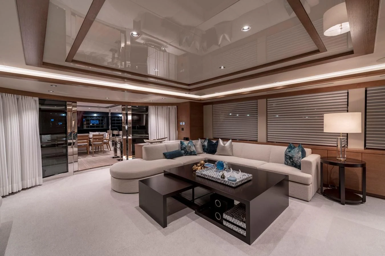 a living room with a couch and a table aboard WESTPORT 112 #7766 Yacht for Sale