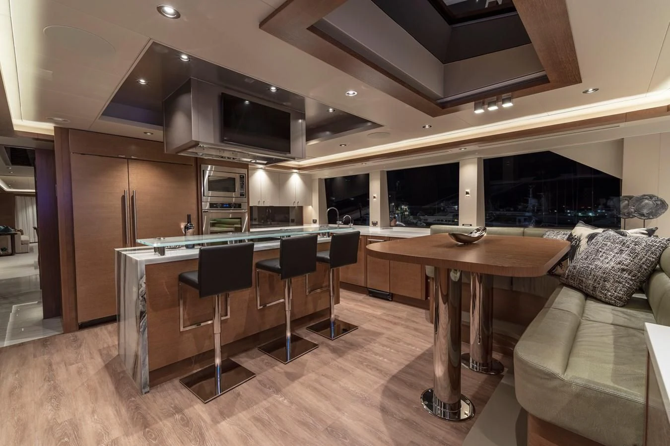 a room with a table and chairs aboard WESTPORT 112 #7766 Yacht for Sale