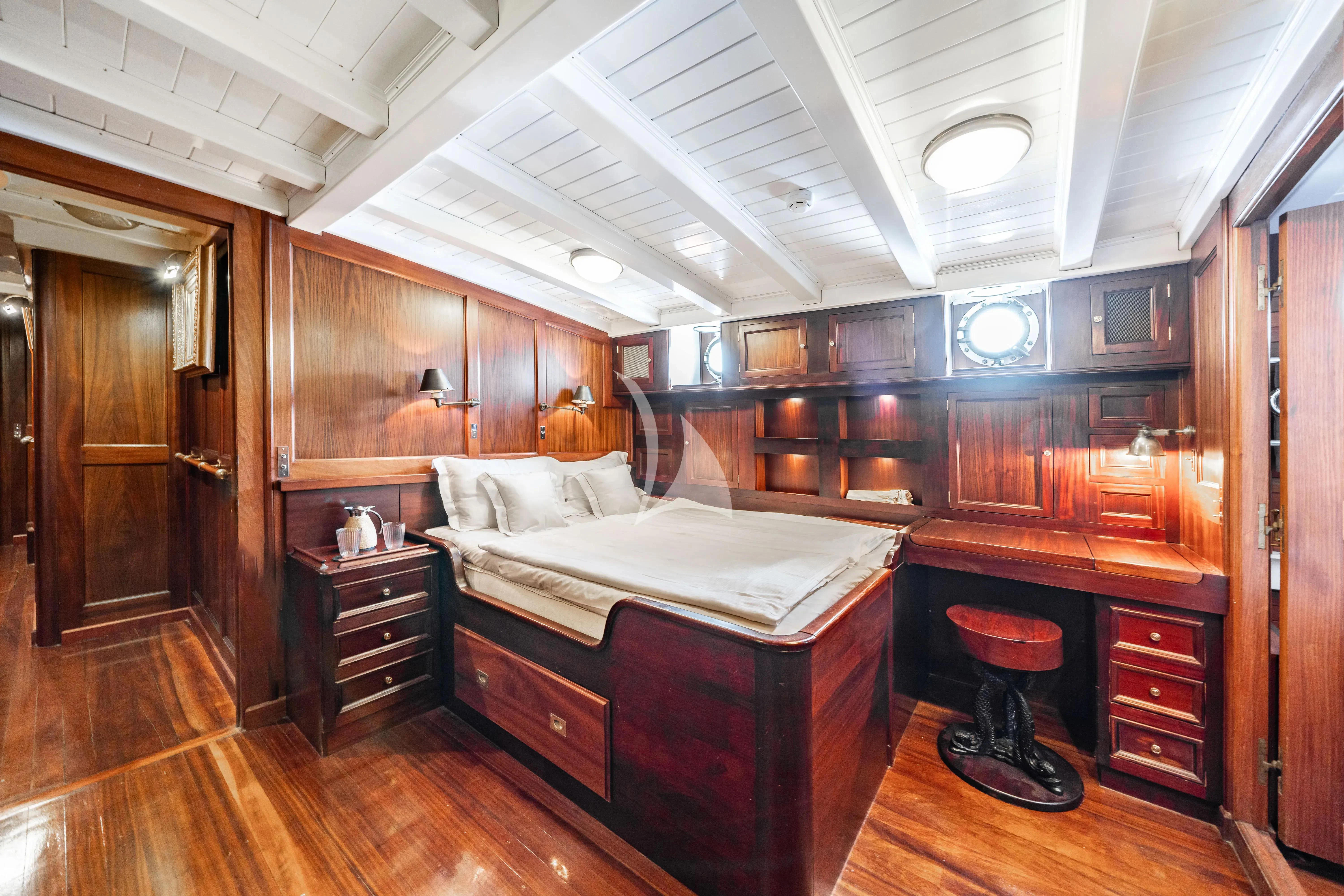 a bedroom with a fireplace aboard TRINAKRIA Yacht for Charter