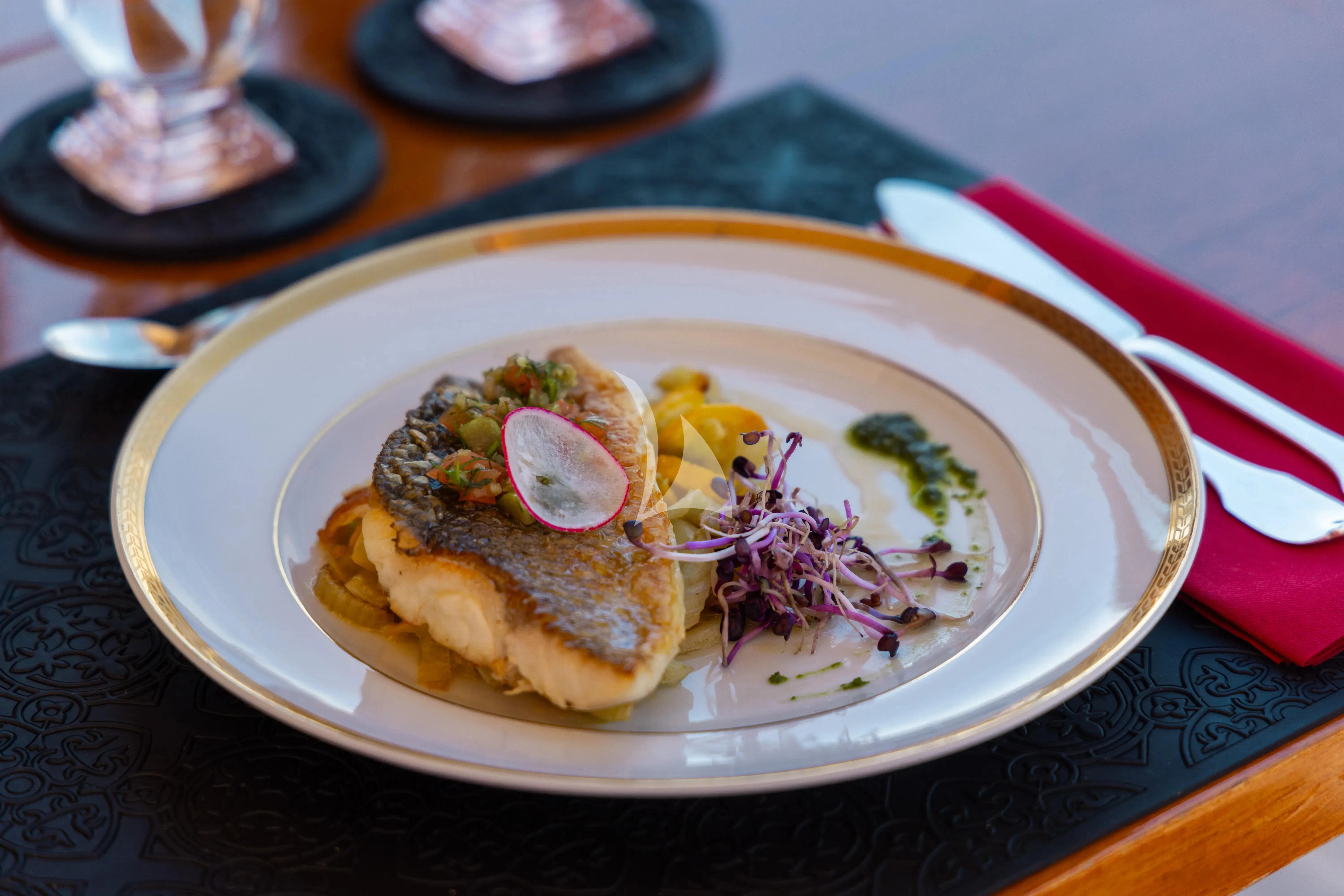 a plate of food aboard TRINAKRIA Yacht for Charter