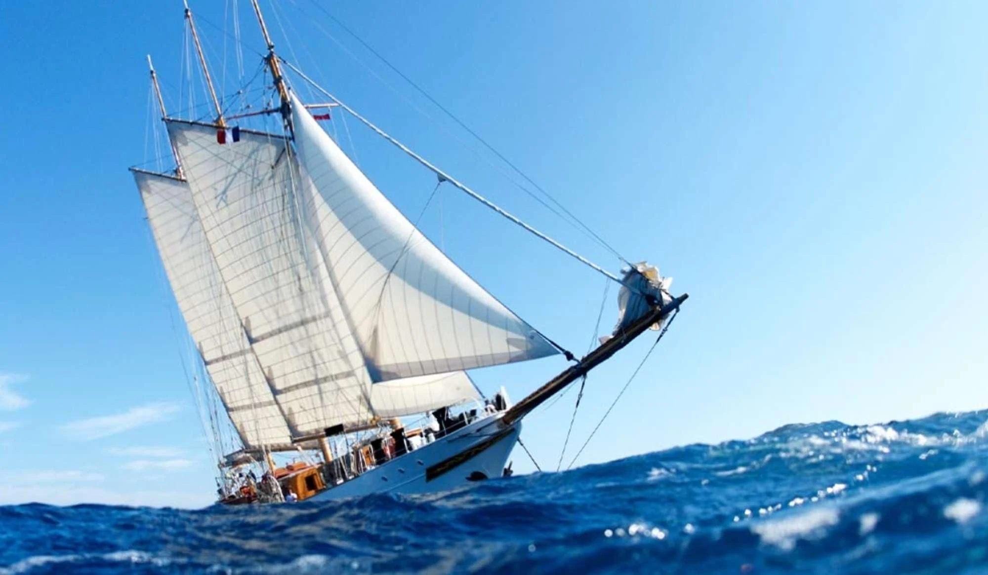 a man on a sailboat aboard TRINAKRIA Yacht for Charter