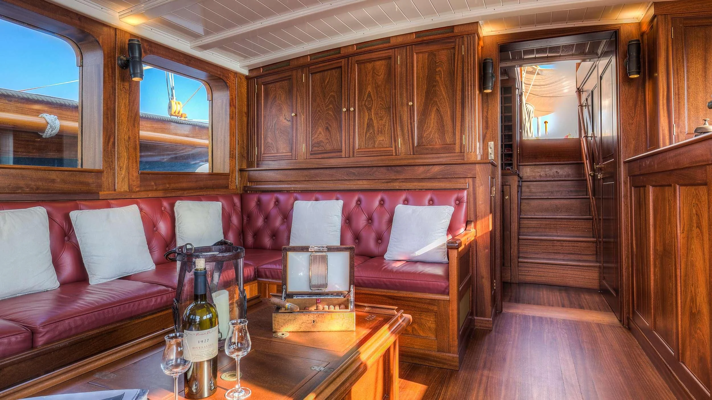 a room with a bed and a table aboard TRINAKRIA Yacht for Charter