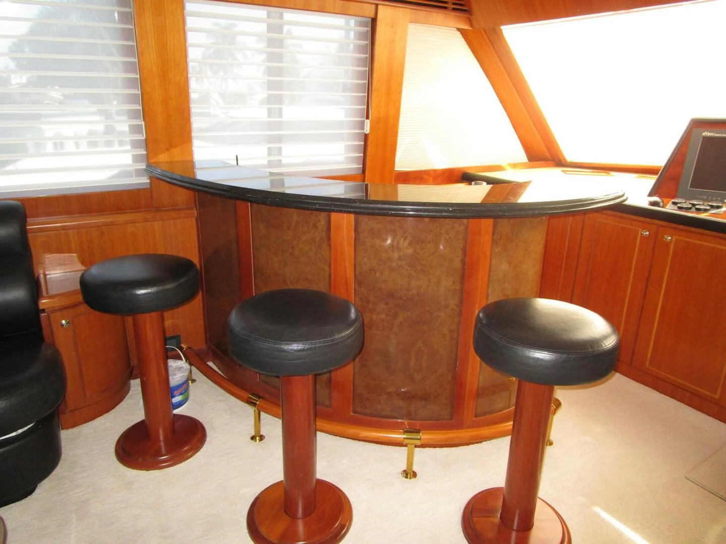 a wooden desk with stools aboard LADY D Yacht for Sale