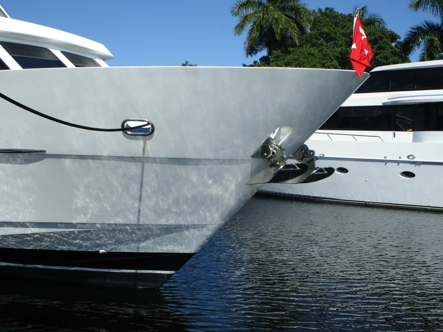 a boat with a flag on the front aboard LADY D Yacht for Sale