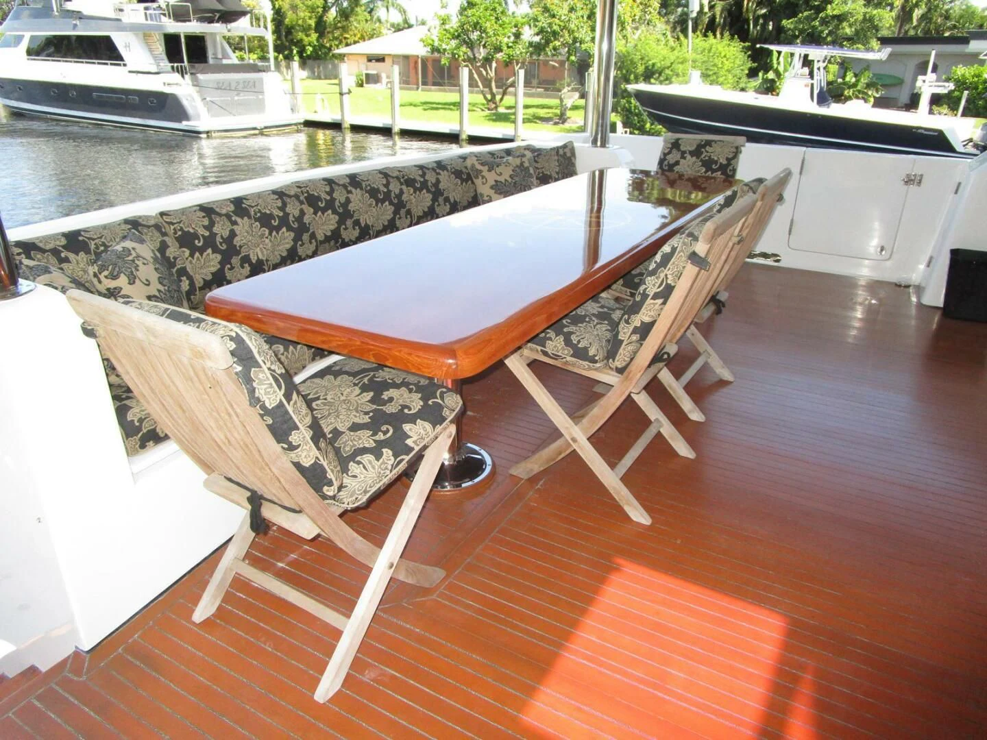 a table and chairs on a deck aboard LADY D Yacht for Sale