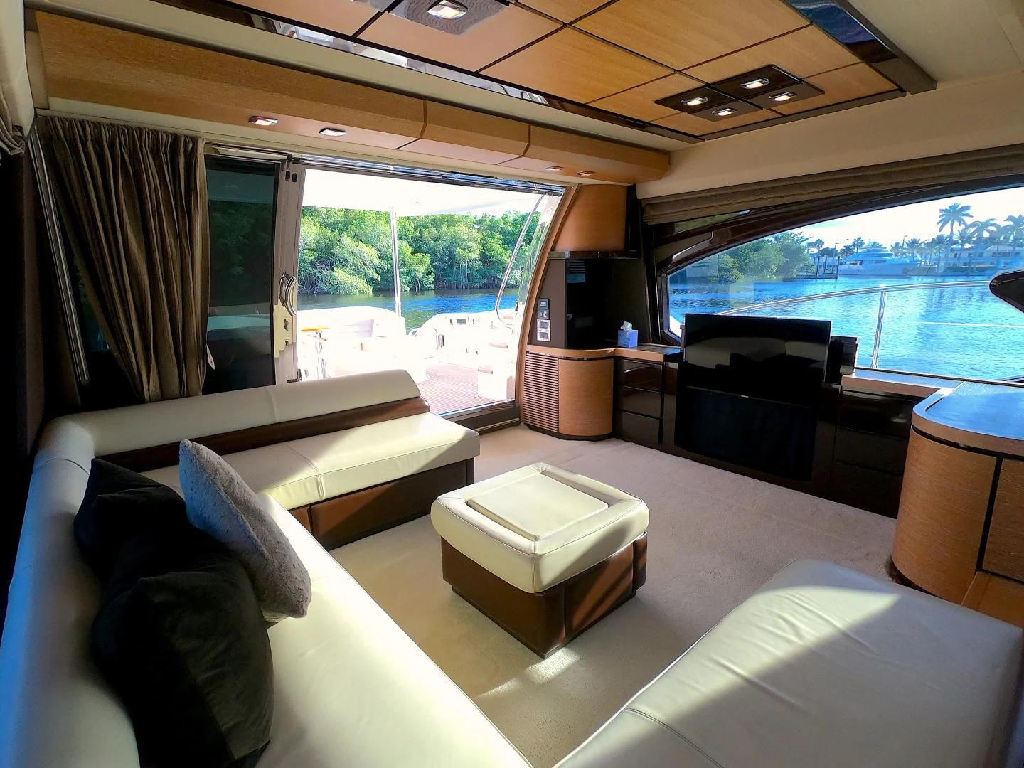a living room with a large window aboard BT 2 Yacht for Sale
