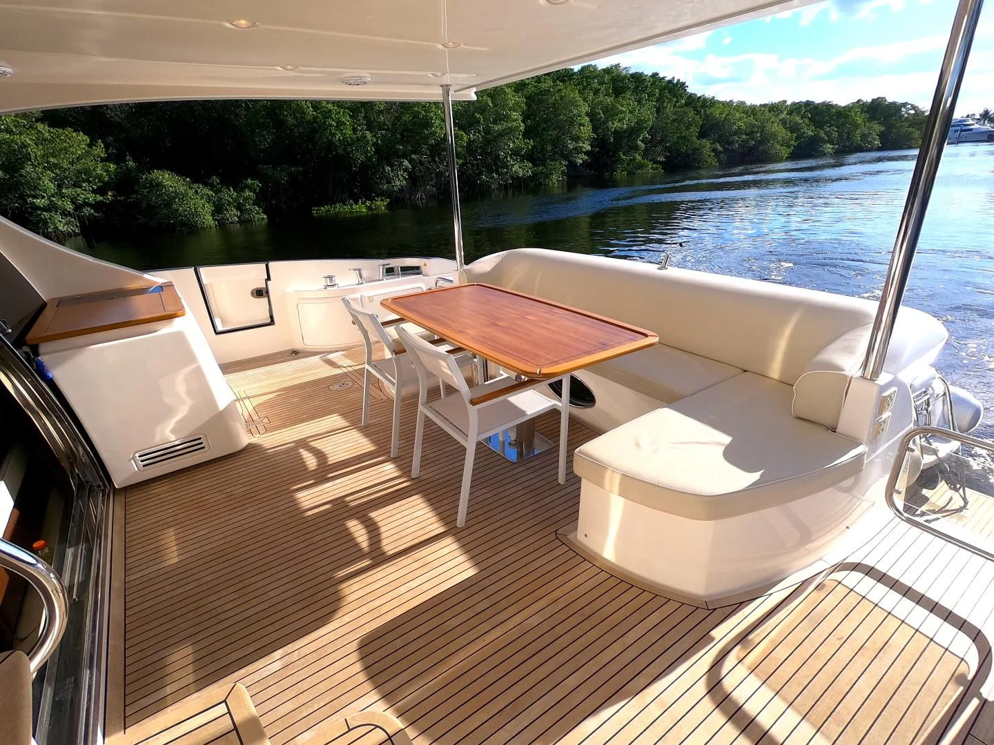 a room with a table and chairs aboard BT 2 Yacht for Sale