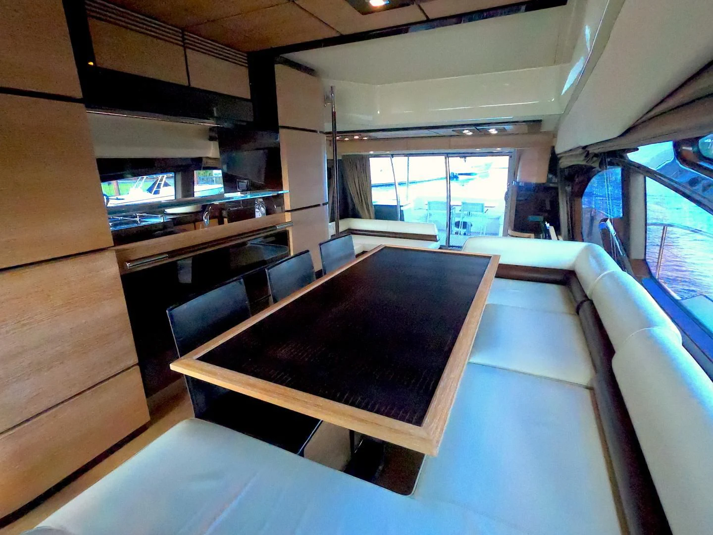 a room with a table and chairs aboard BT 2 Yacht for Sale