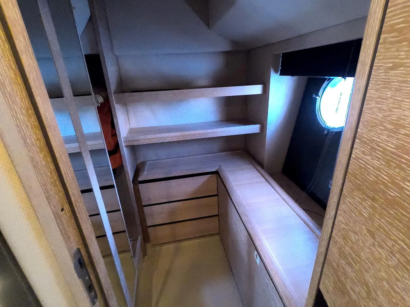 a wooden staircase with a glass window aboard BT 2 Yacht for Sale