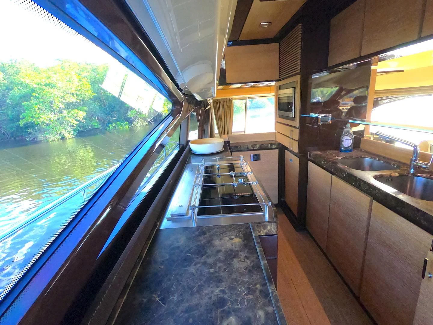 a kitchen with a large window aboard BT 2 Yacht for Sale
