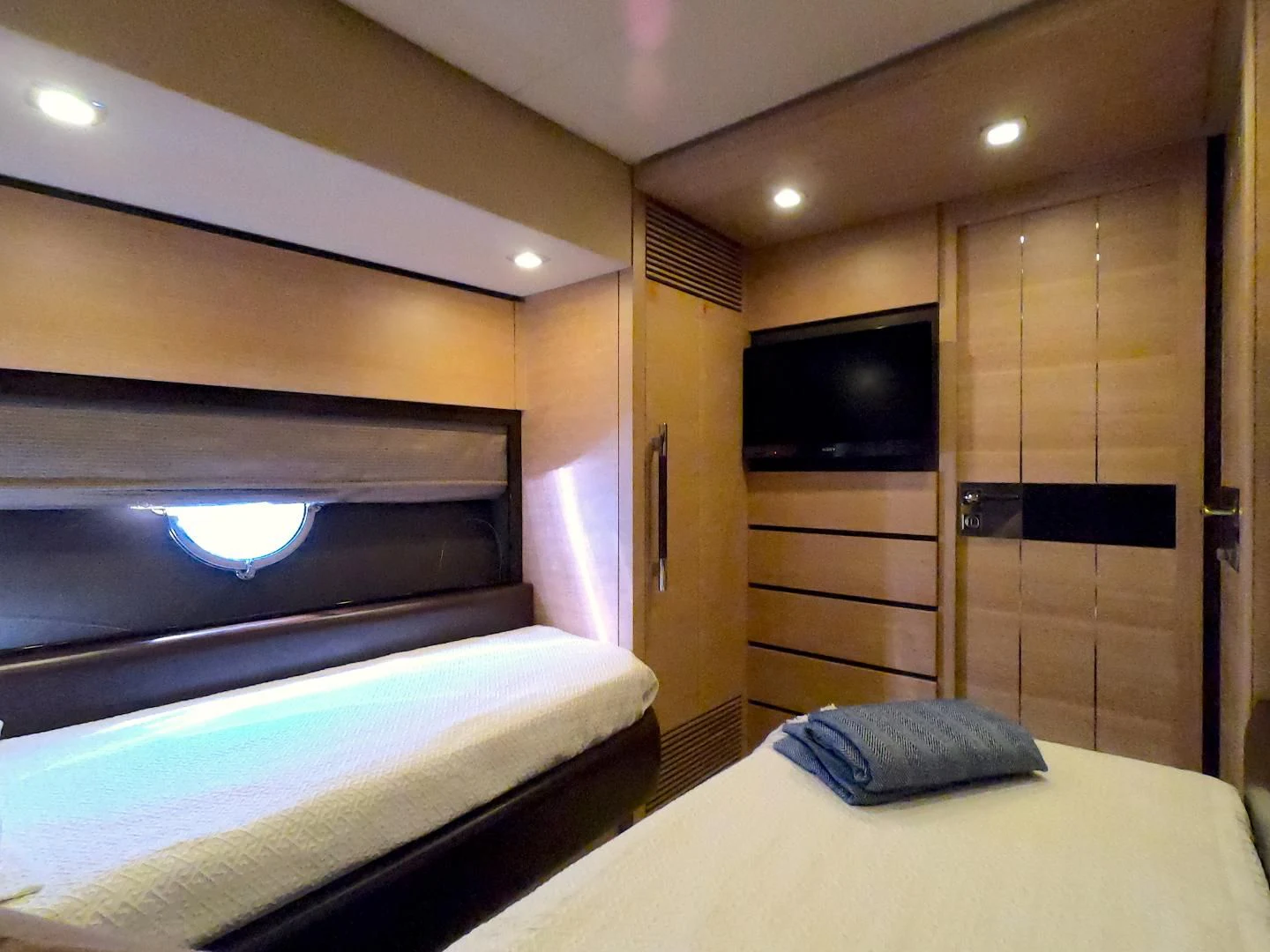 a room with a bed and a television aboard BT 2 Yacht for Sale