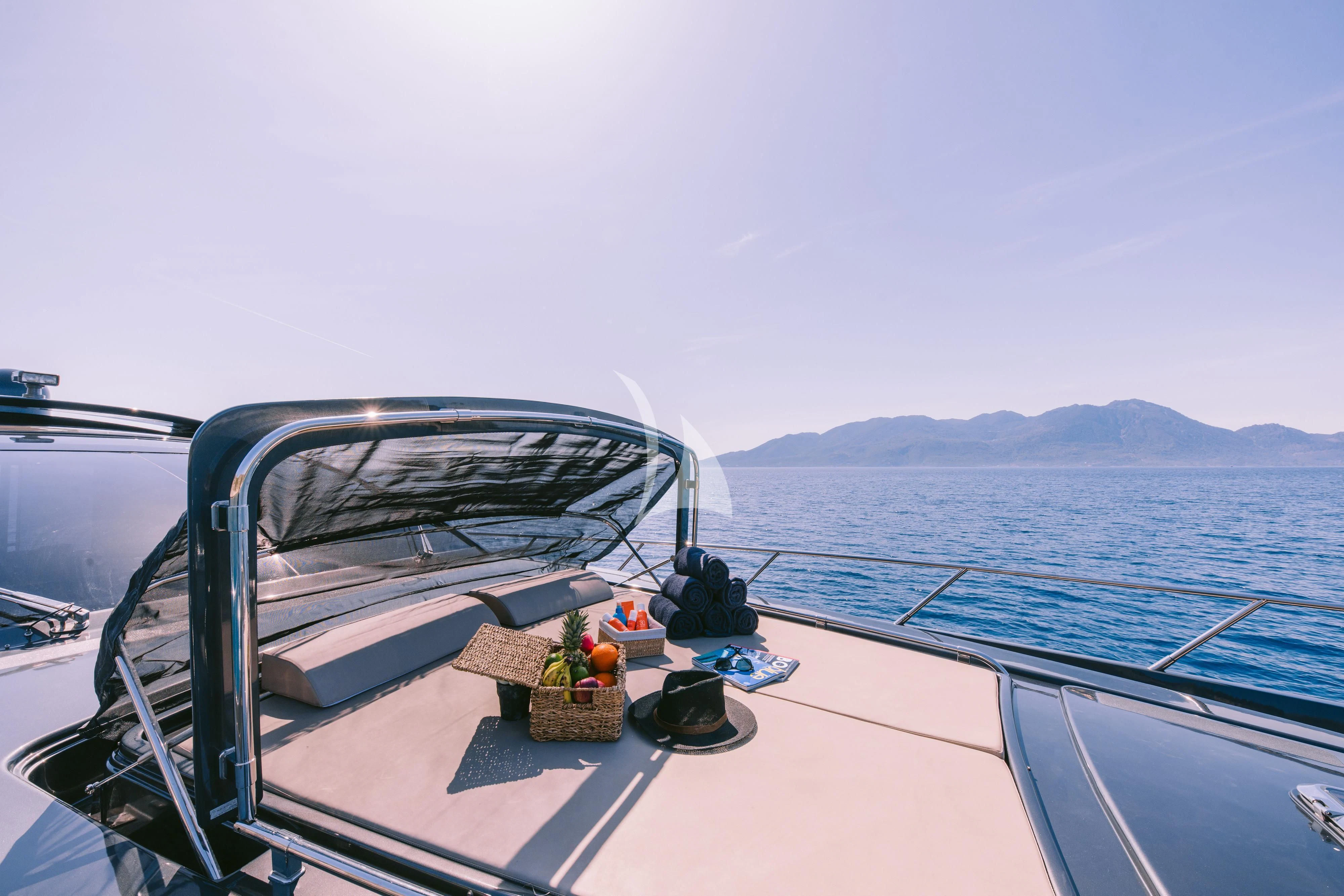 a boat with a basket of fruit on the front aboard WHO CARES Yacht for Sale