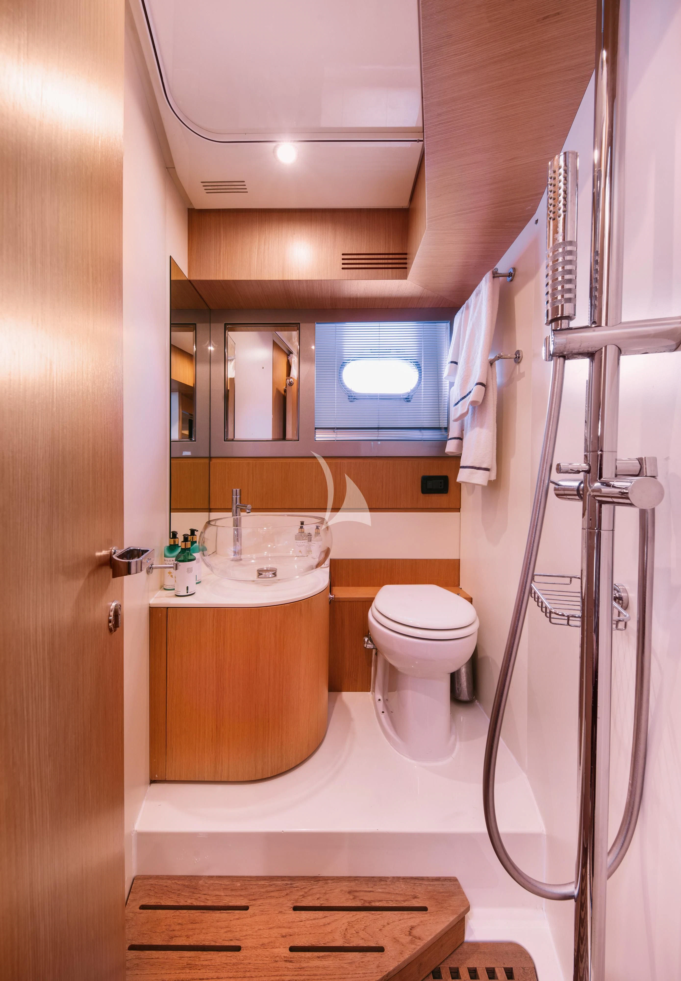 a bathroom with a shower unit and sink aboard WHO CARES Yacht for Sale