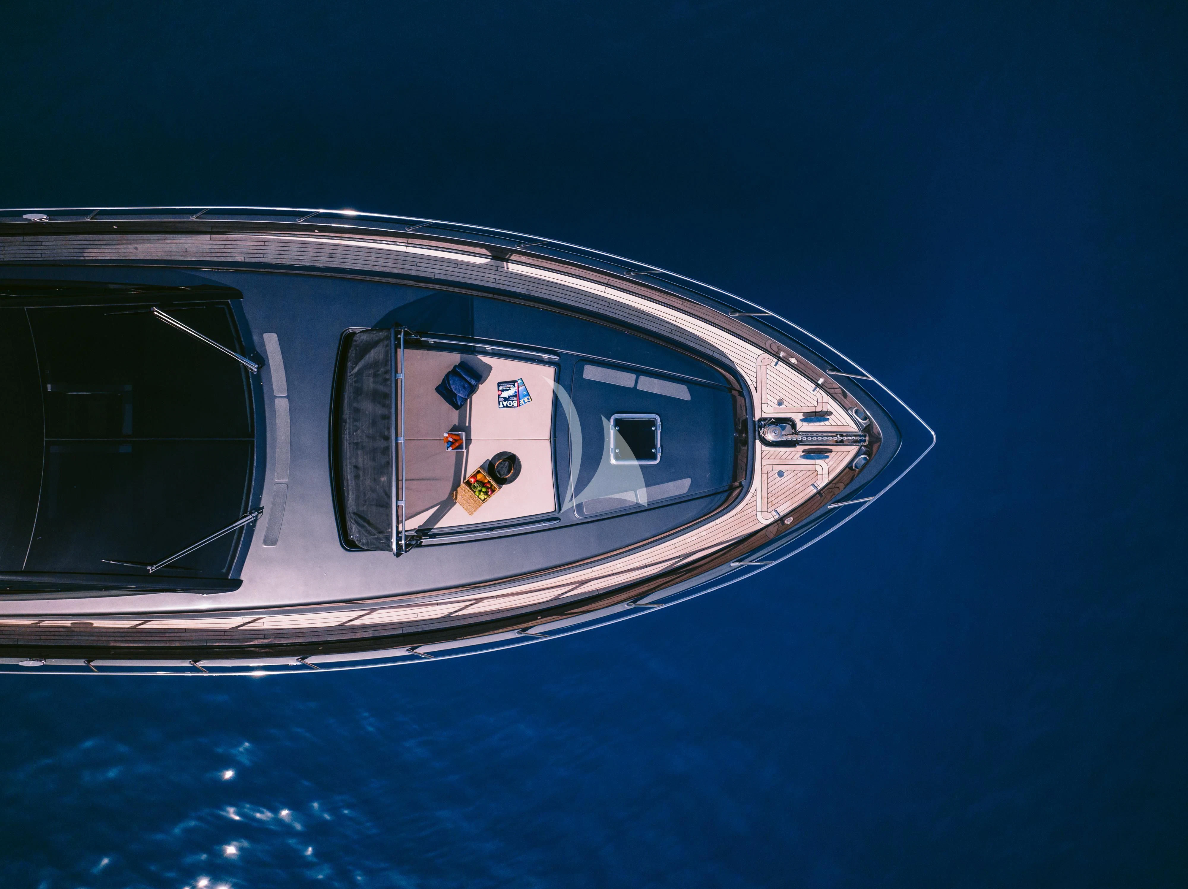a view of a plane's window and a reflection of a person aboard WHO CARES Yacht for Sale