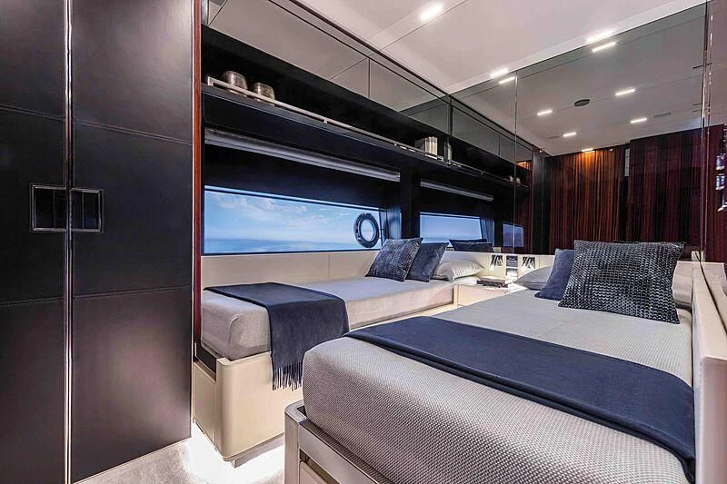 a room with a bed and a tv aboard GREY SHARK Yacht for Sale