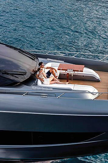 a man and woman on a boat aboard GREY SHARK Yacht for Sale