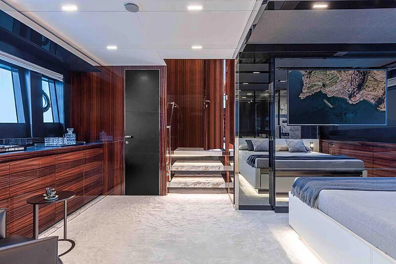 a room with a bed and a tv aboard GREY SHARK Yacht for Sale