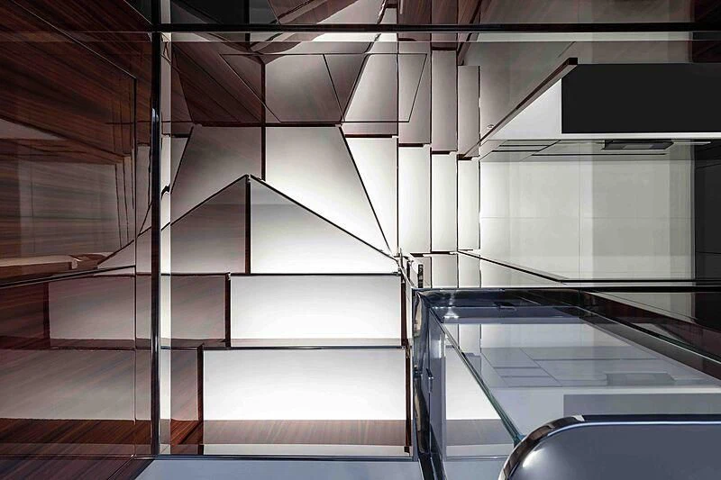 a room with a staircase and a railing aboard GREY SHARK Yacht for Sale