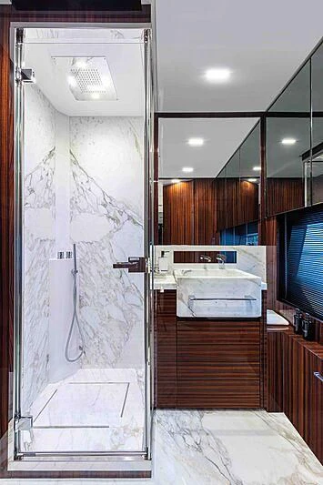 a bathroom with a sink and a mirror aboard GREY SHARK Yacht for Sale