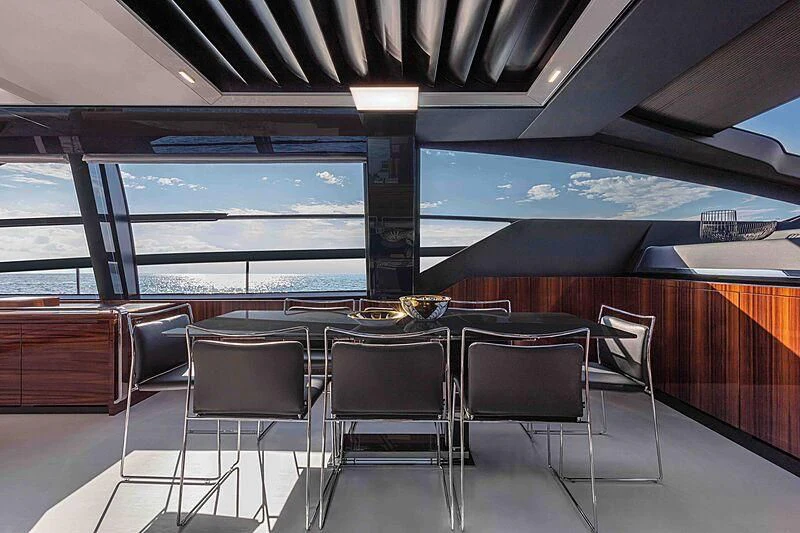 a room with chairs and a table aboard GREY SHARK Yacht for Sale