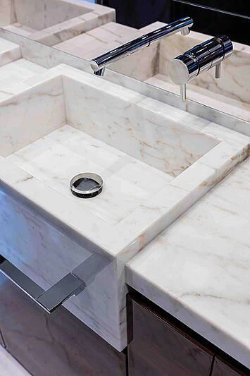 a white sink with a faucet aboard GREY SHARK Yacht for Sale