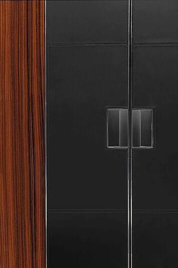 a black door with a silver lock aboard GREY SHARK Yacht for Sale