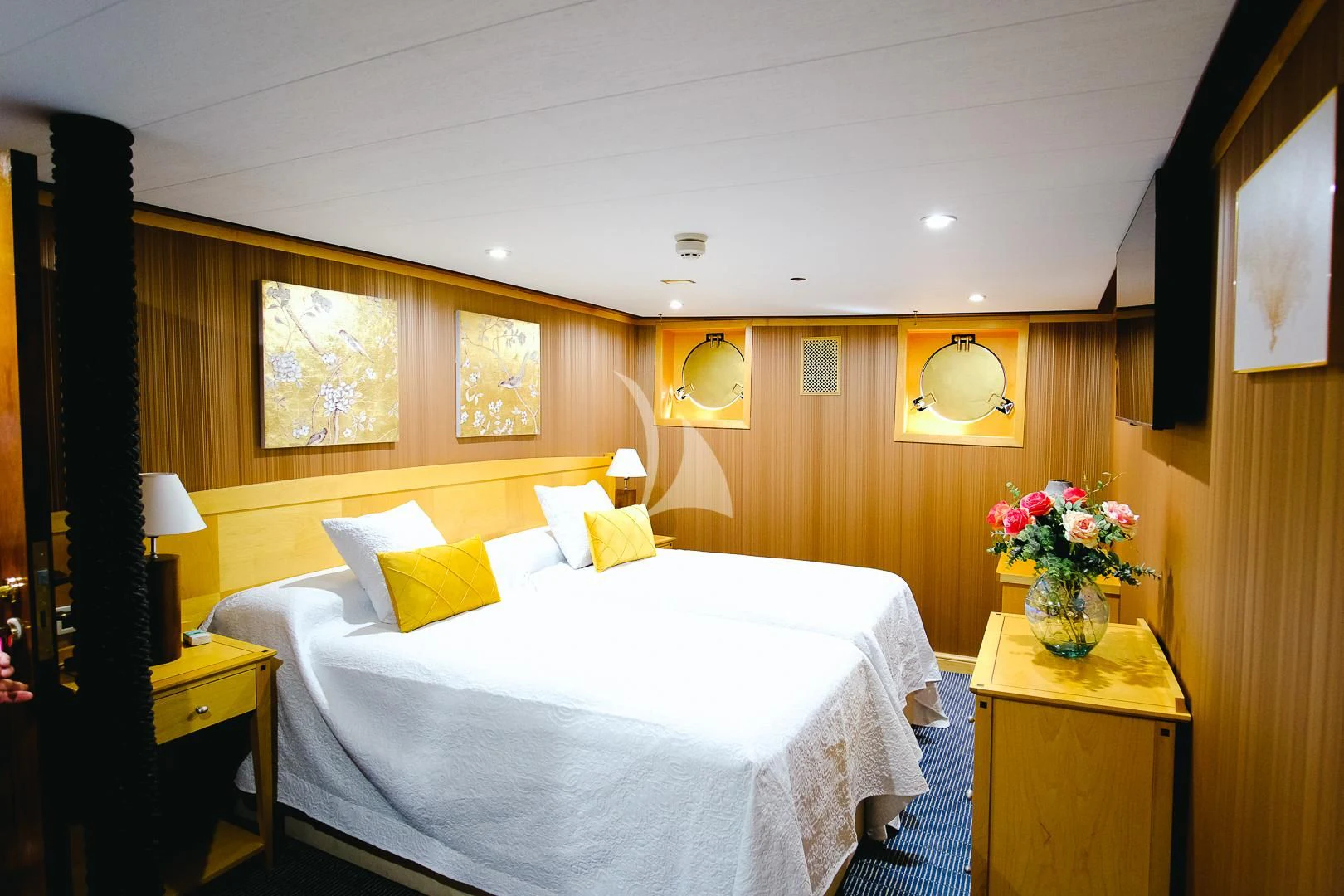 a hotel room with a bed and a desk aboard HARMONY II Yacht for Sale