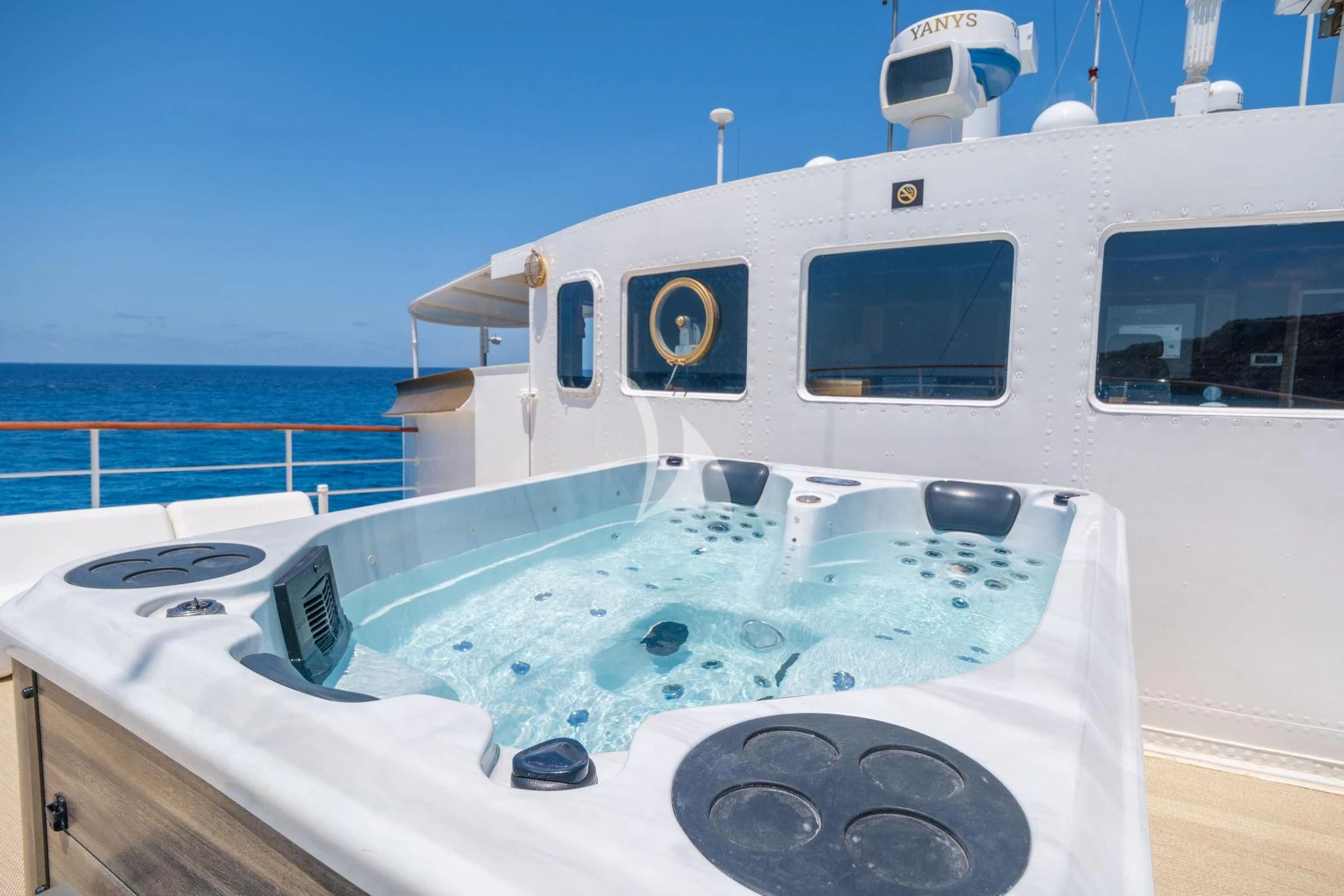 a white boat with a blue sky aboard HARMONY II Yacht for Sale