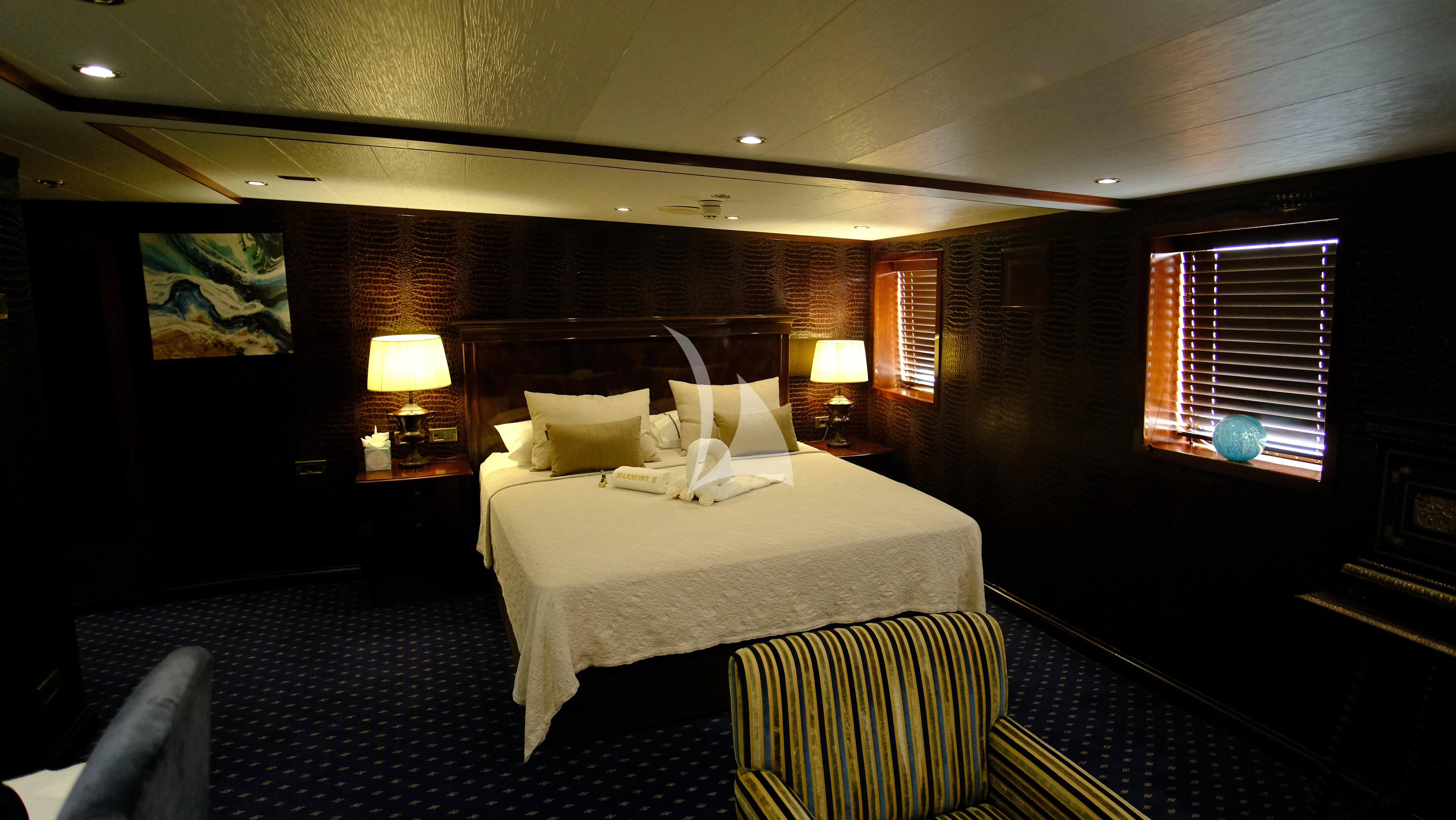 a bed in a room aboard HARMONY II Yacht for Sale