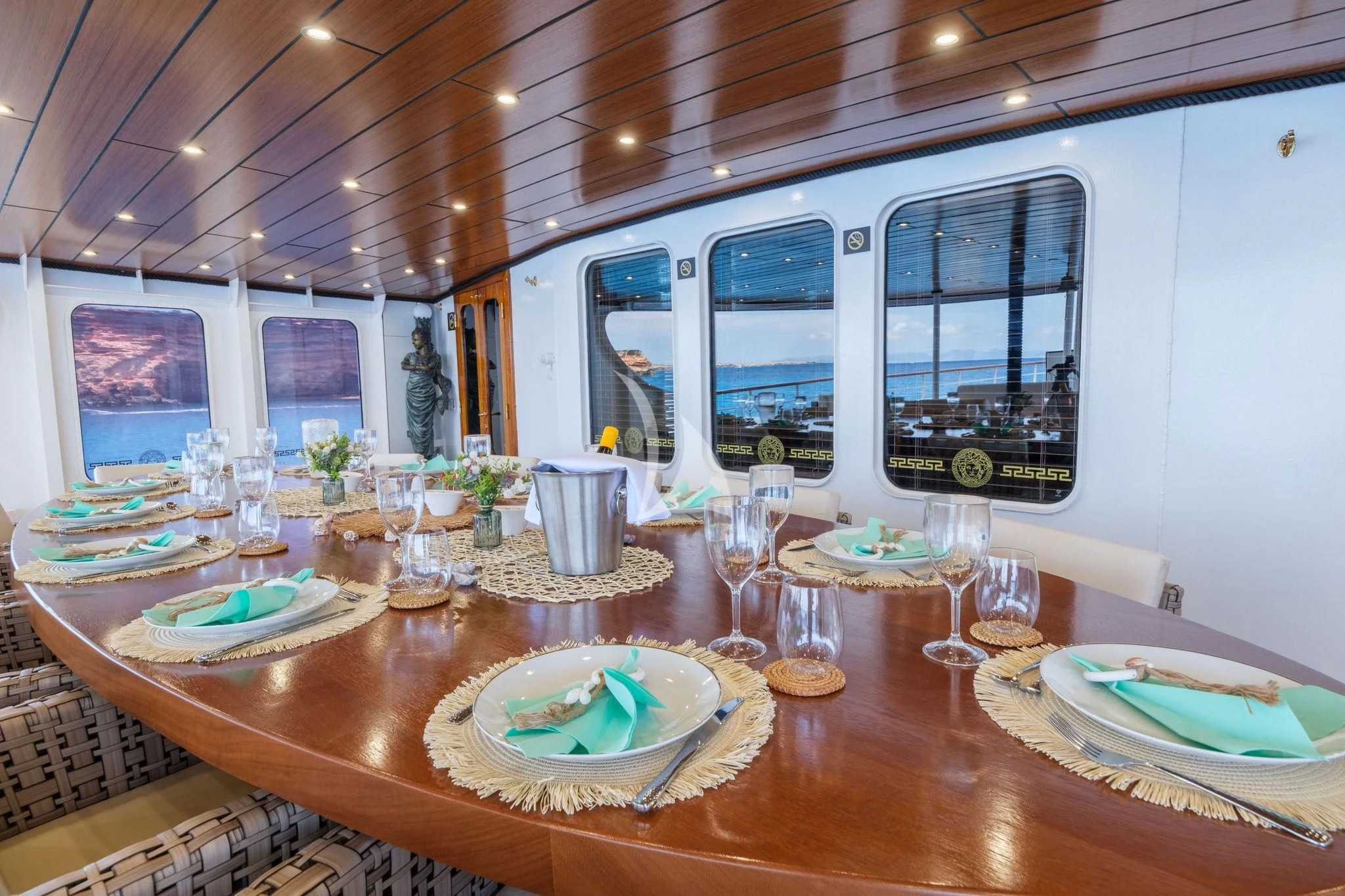 a table with plates and glasses on it aboard HARMONY II Yacht for Sale