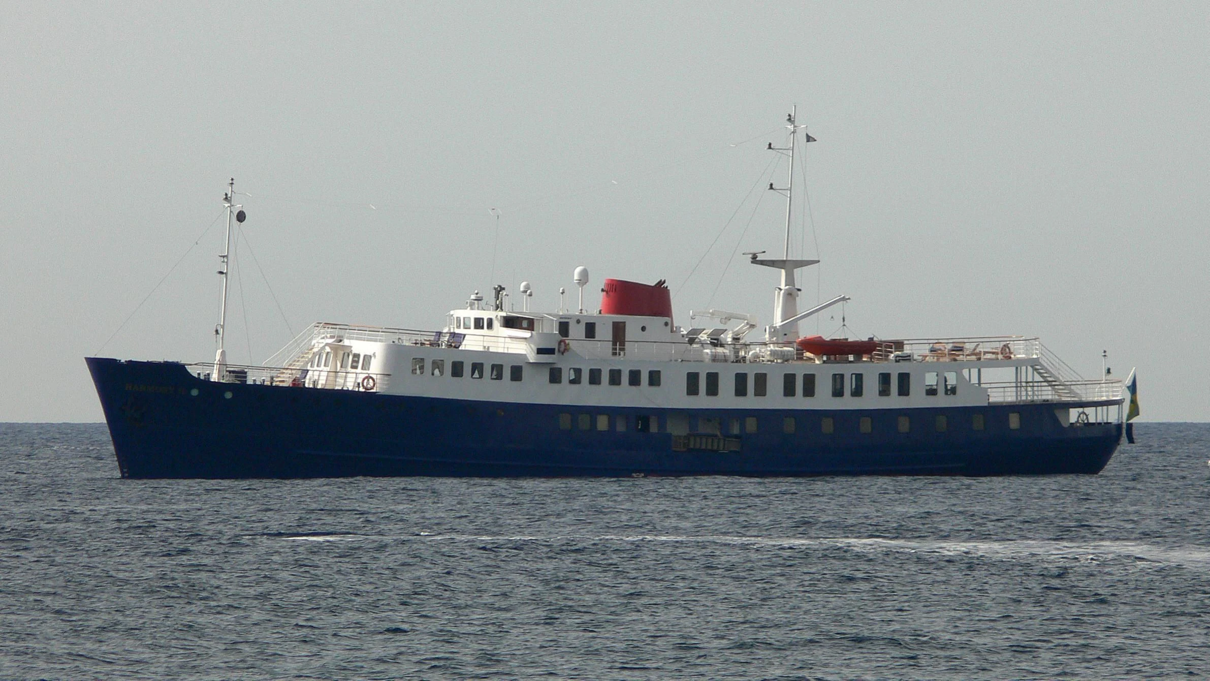 a large boat in the water aboard HARMONY II Yacht for Sale