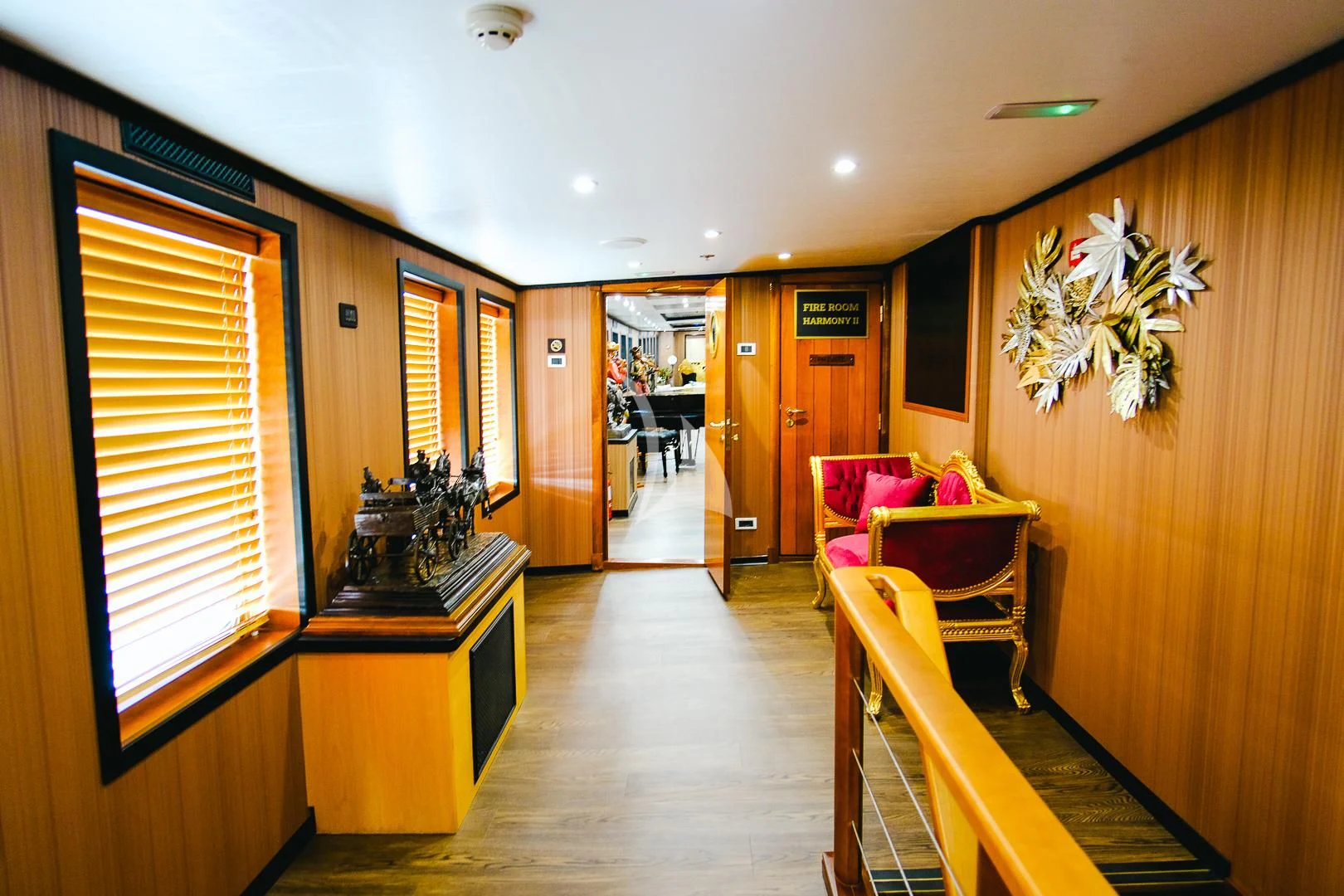 a room with a wood floor and a wood door and a window aboard HARMONY II Yacht for Sale