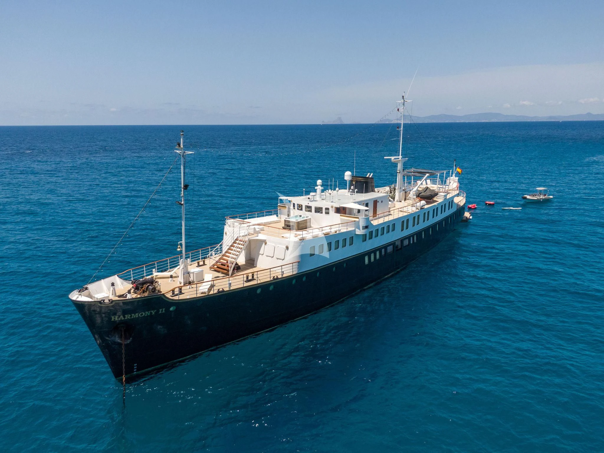 a large ship in the water aboard HARMONY II Yacht for Sale