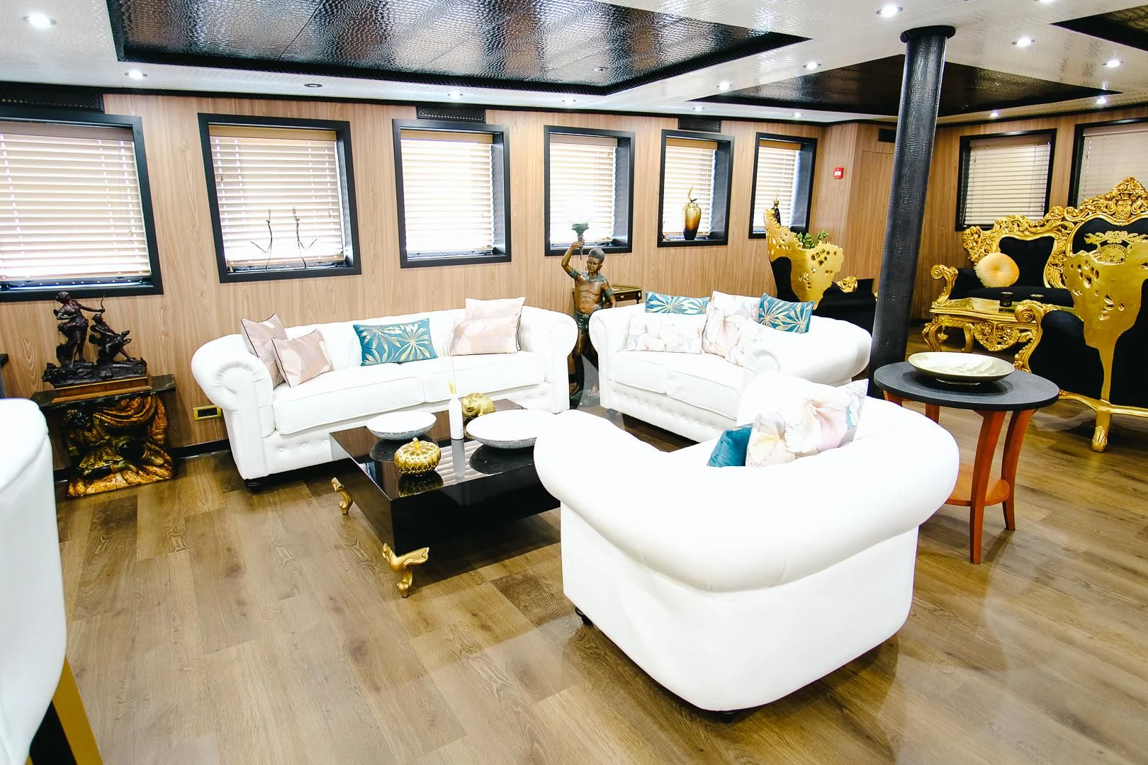 a living room with a couch and coffee table aboard HARMONY II Yacht for Sale