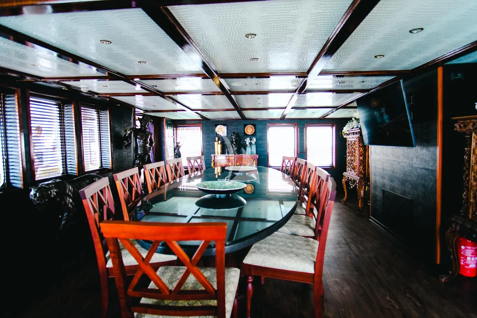 a room with a table chairs and a pool table aboard HARMONY II Yacht for Sale