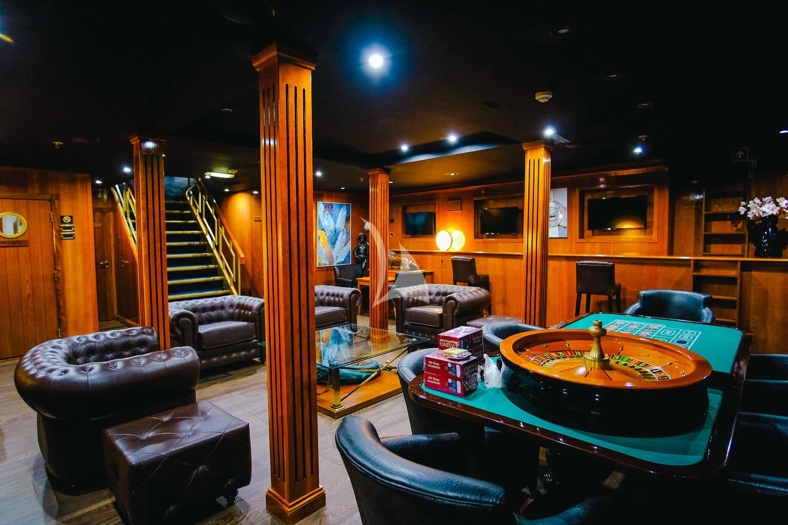 a pool table in a room aboard HARMONY II Yacht for Sale