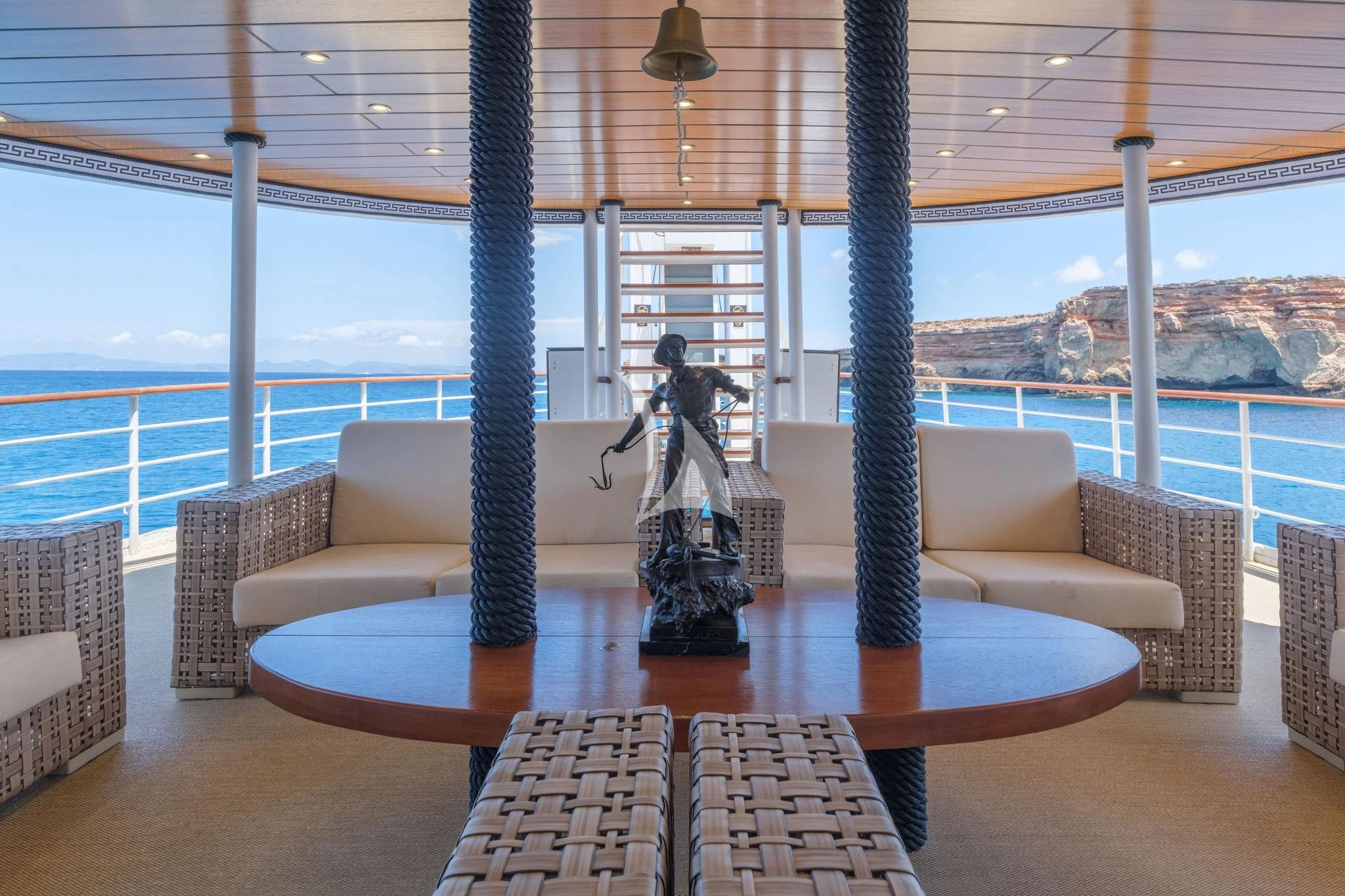a person sitting on a chair aboard HARMONY II Yacht for Sale