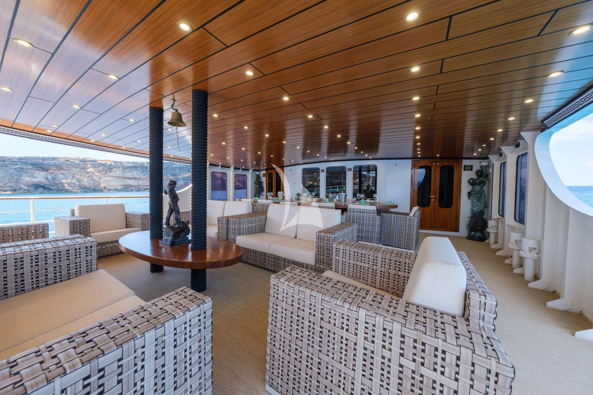 a large living room with a large patio and a large body of water aboard HARMONY II Yacht for Sale