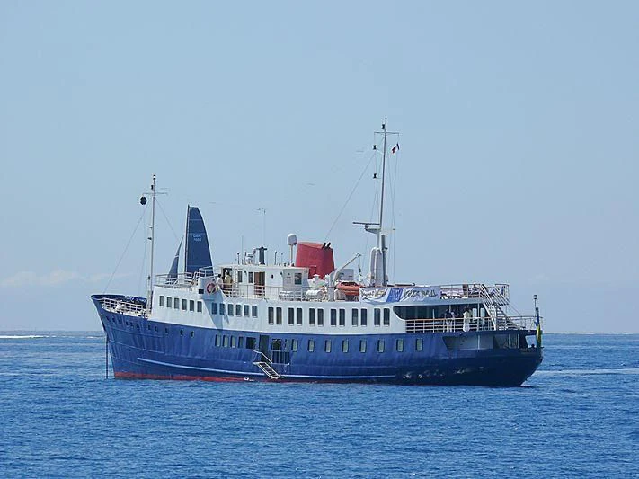a large boat in the water aboard HARMONY II Yacht for Sale