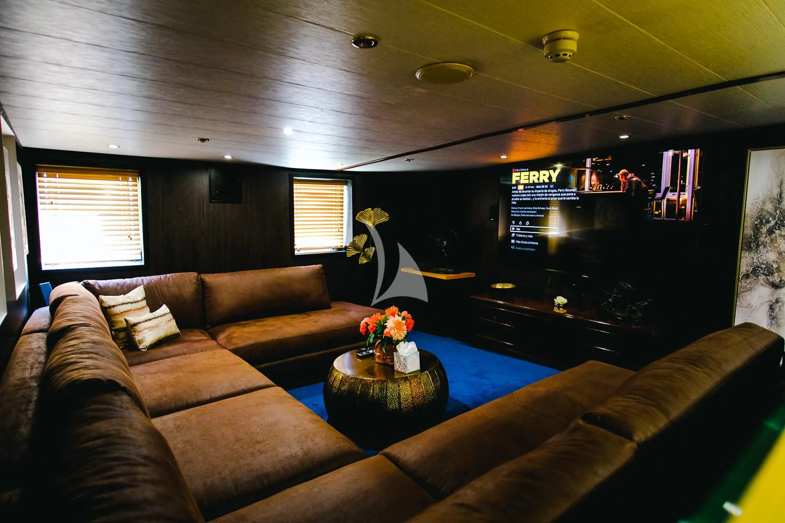 a living room with a couch and a coffee table aboard HARMONY II Yacht for Sale