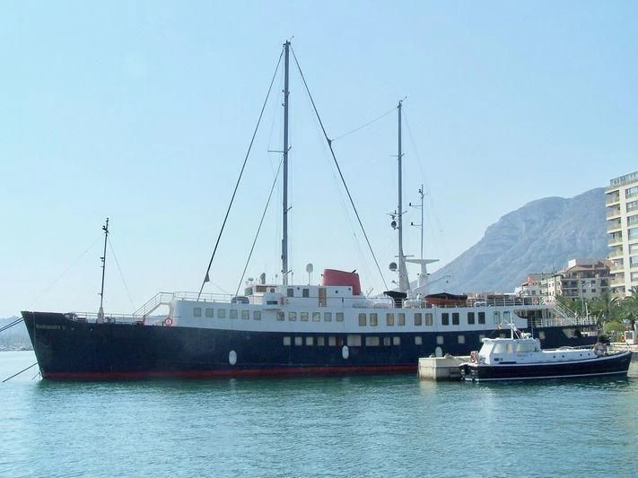 a large ship in the water aboard HARMONY II Yacht for Sale