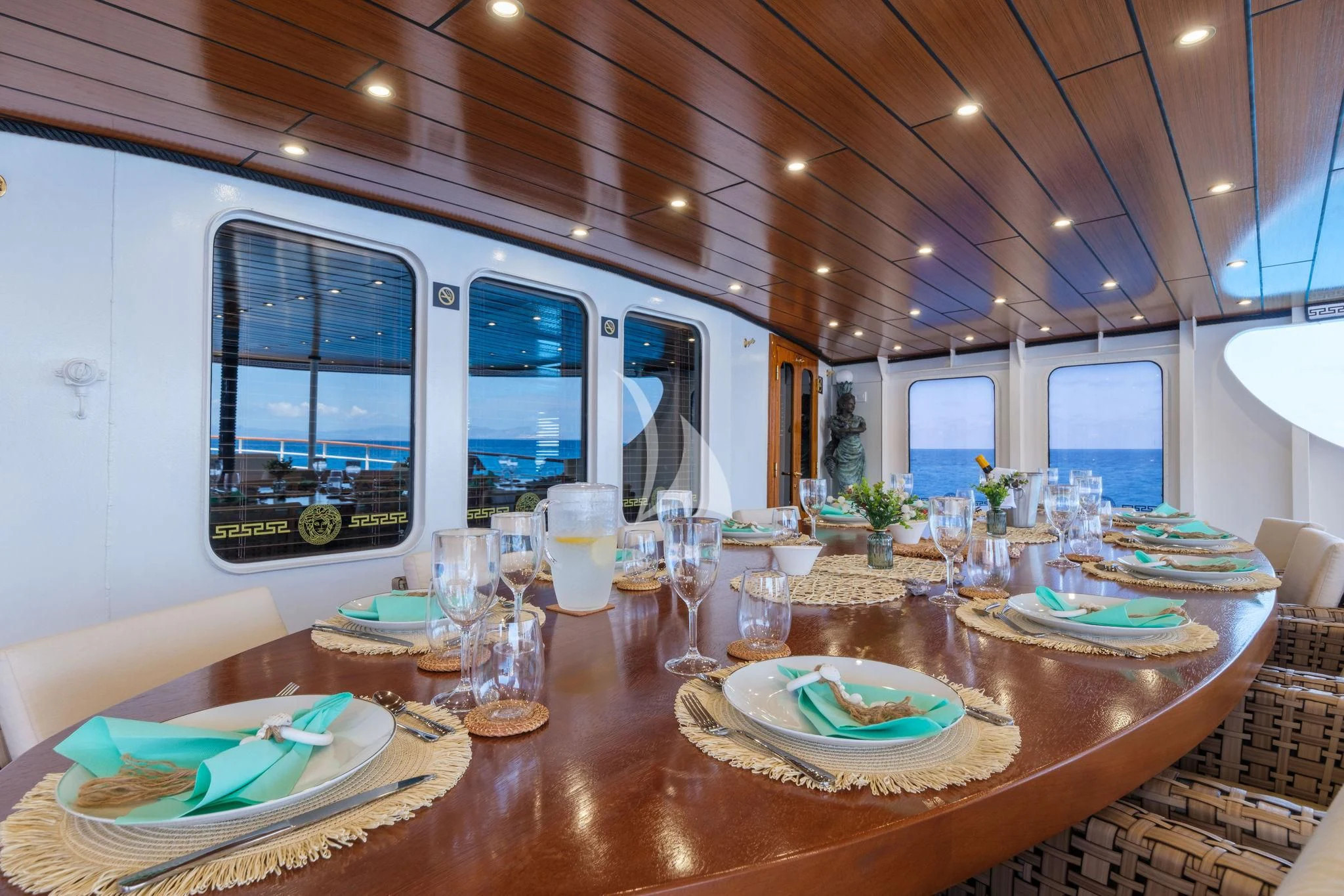 a table with plates and glasses on it aboard HARMONY II Yacht for Sale