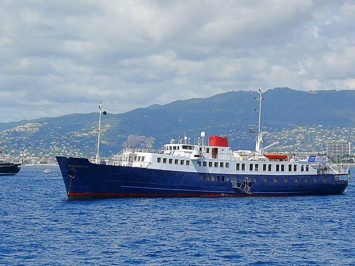 a large blue and white boat in the water aboard HARMONY II Yacht for Sale