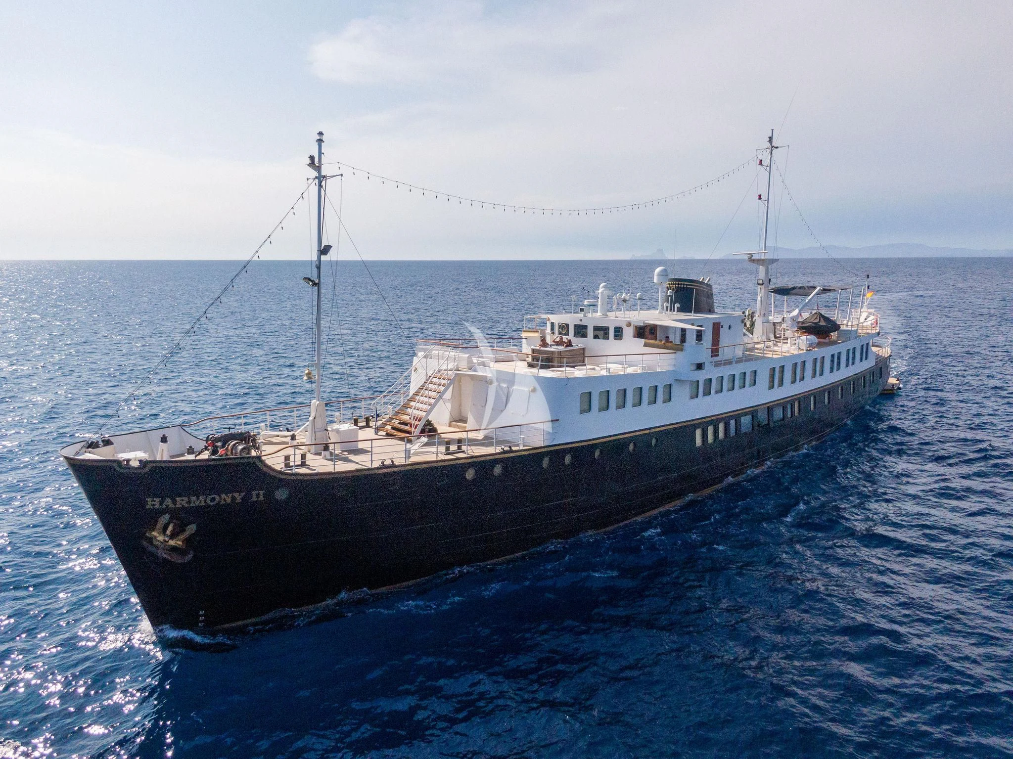 a large ship in the water aboard HARMONY II Yacht for Sale