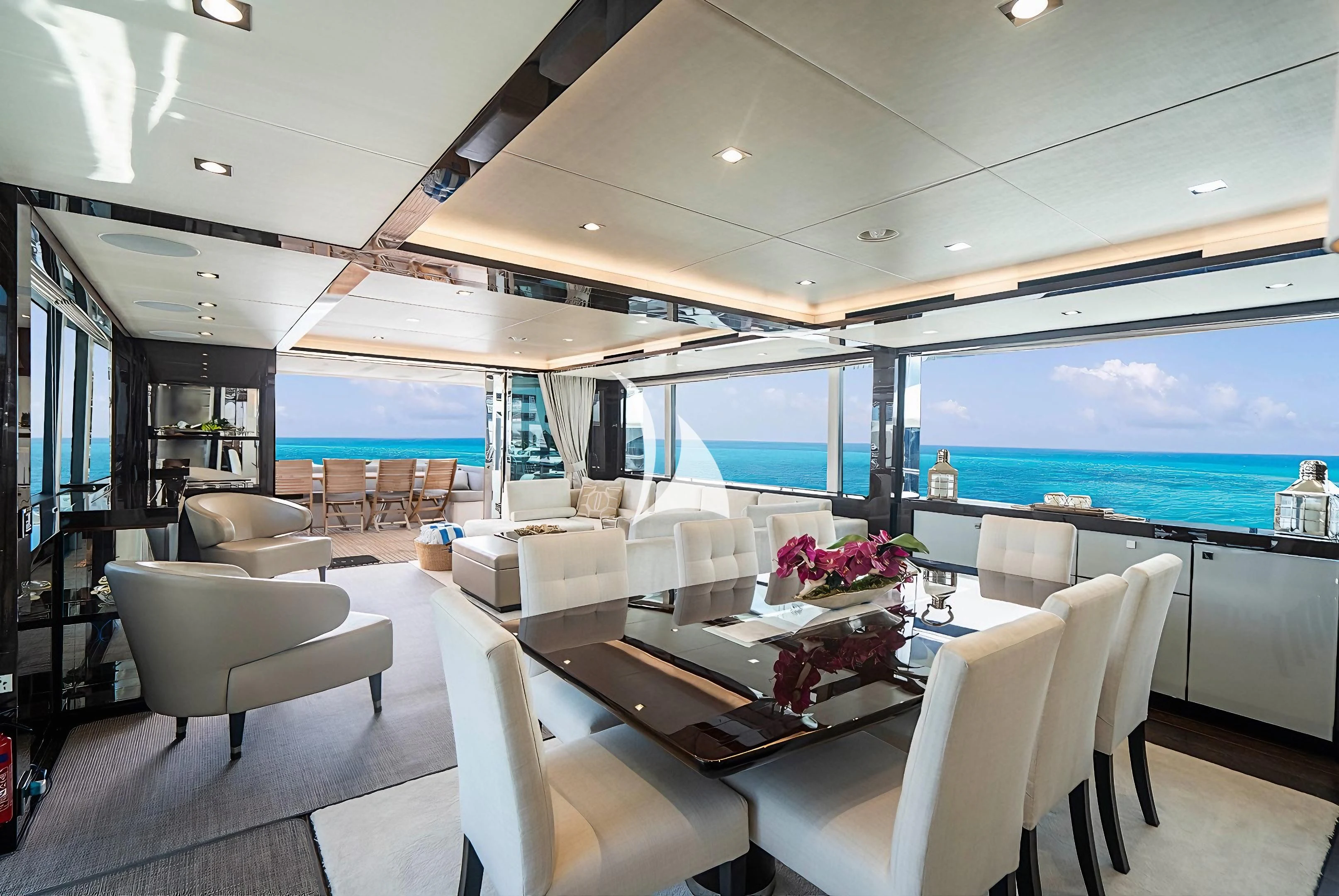 a room with a large window and a view of the ocean aboard QUANTUM Yacht for Sale