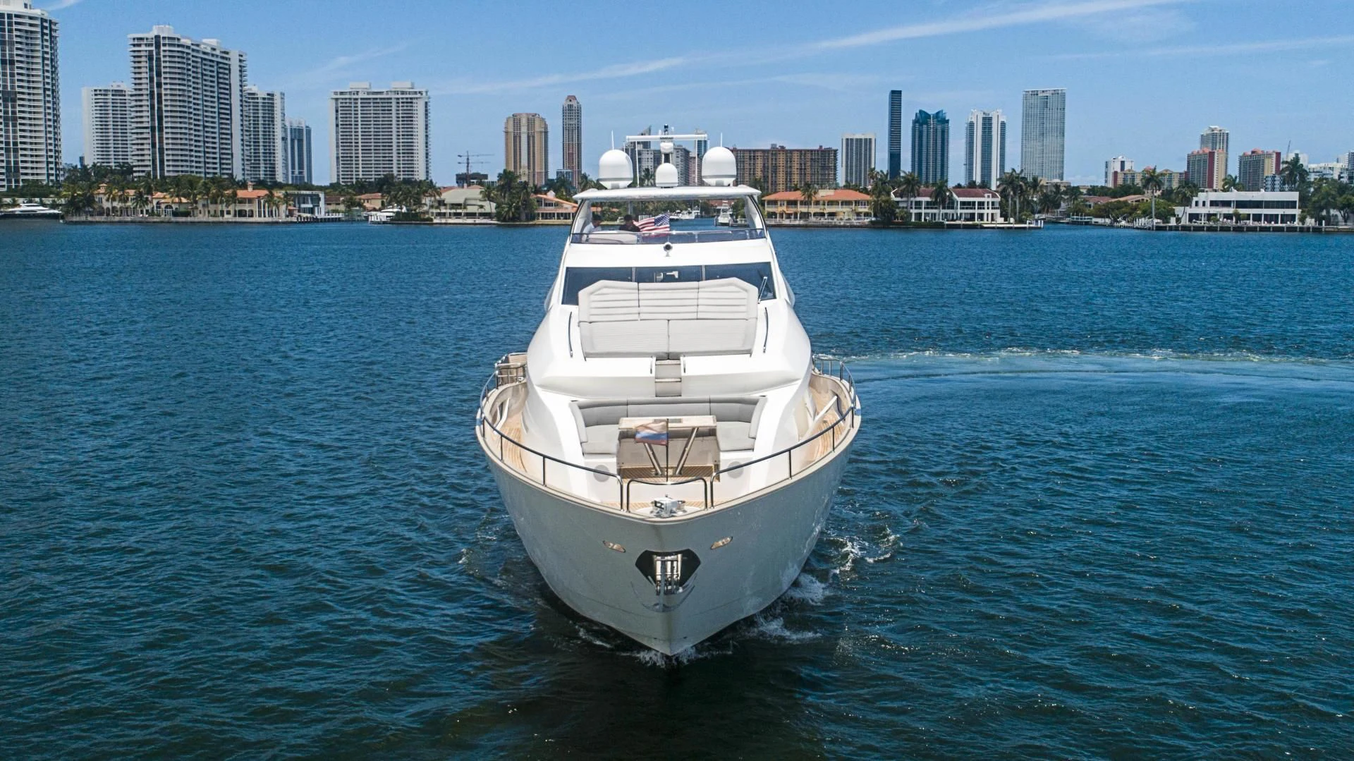 a white boat in the water aboard QUANTUM Yacht for Sale