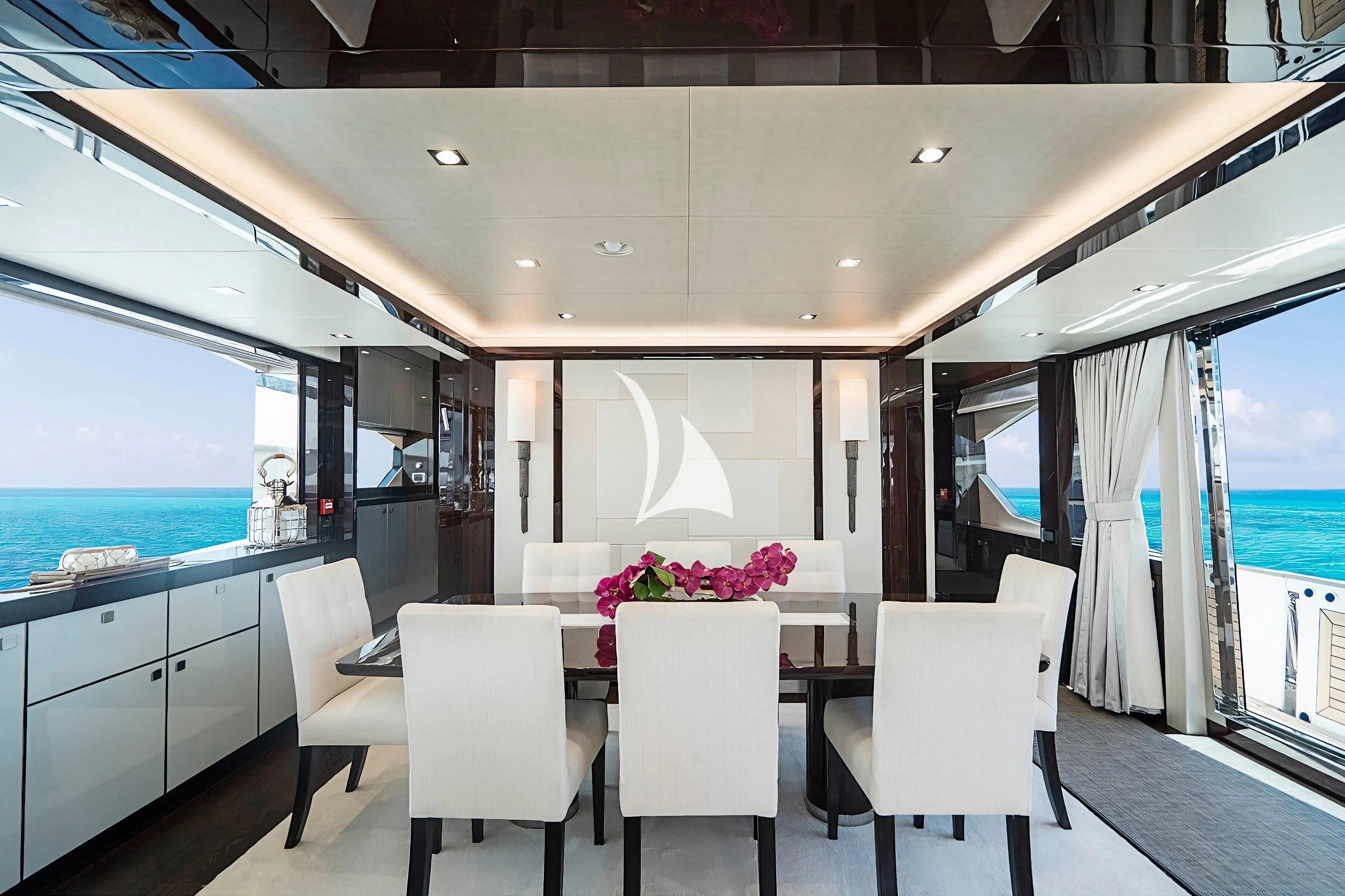 a room with a table chairs and a window aboard QUANTUM Yacht for Sale