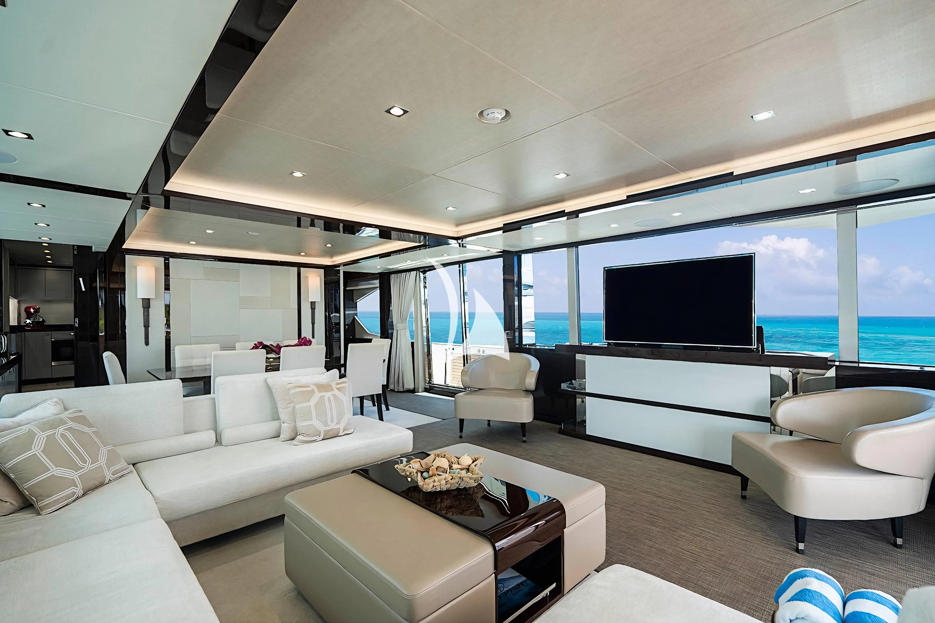 a living room with a large screen aboard QUANTUM Yacht for Sale