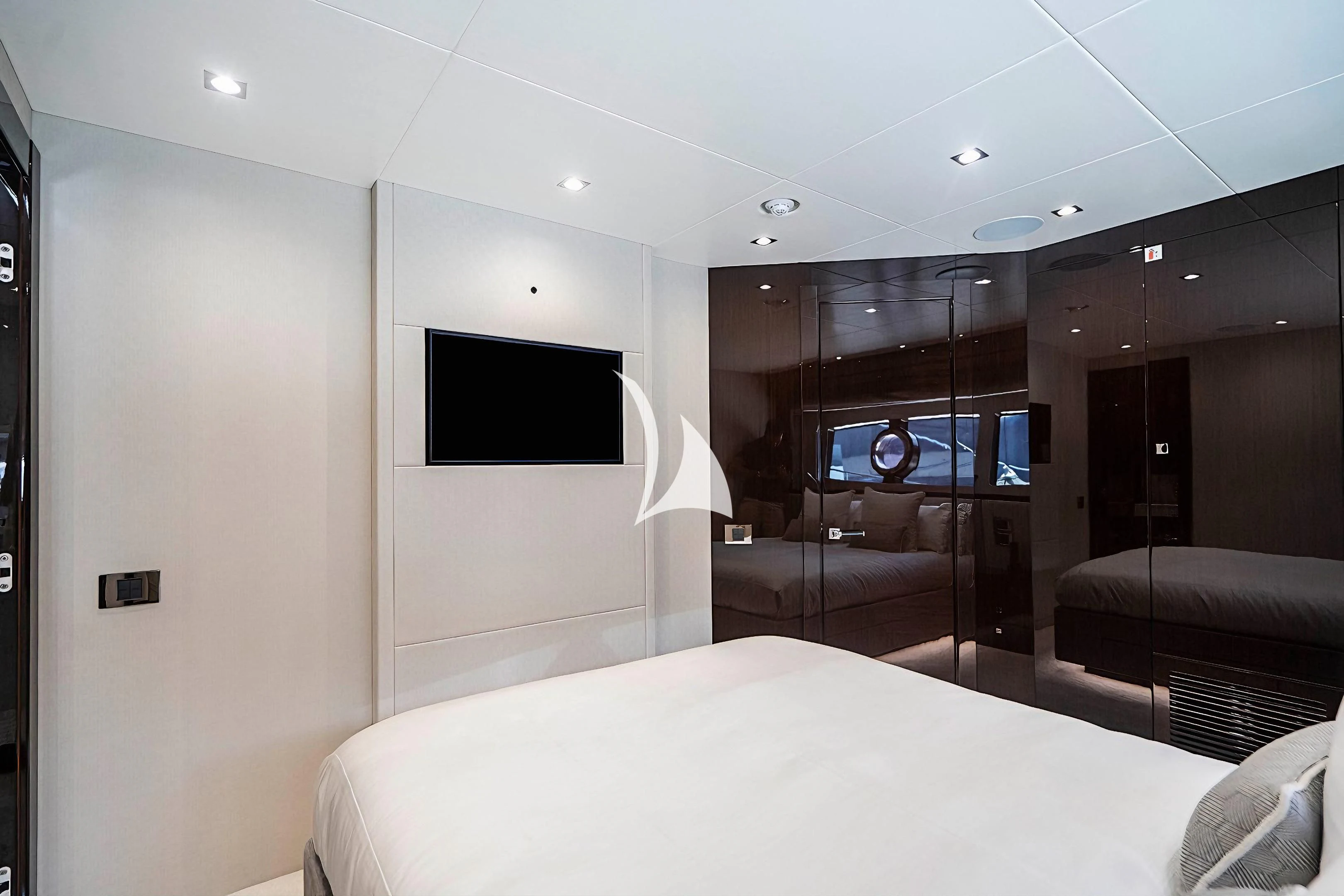a room with a bed and a television aboard QUANTUM Yacht for Sale